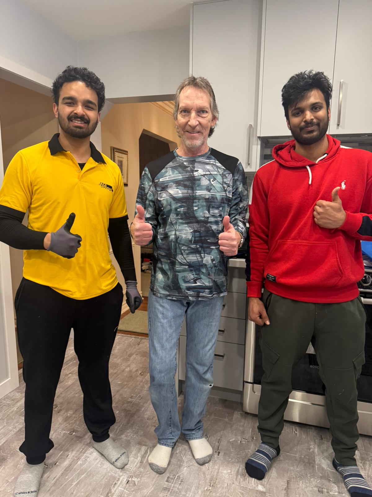 Two Acemovers crew members with a customer after an in-home move