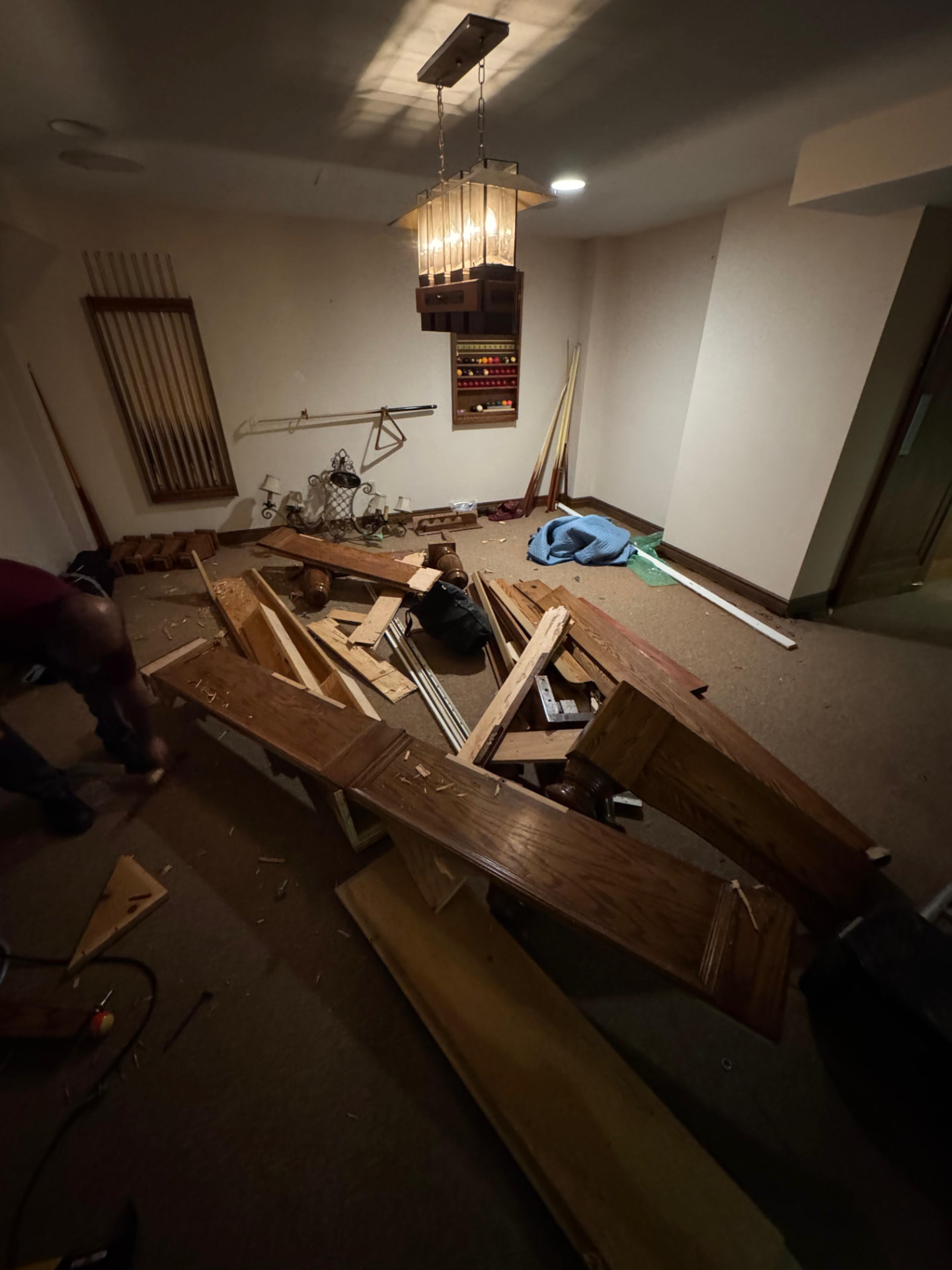 Before: basement furniture removal — space filled with junk